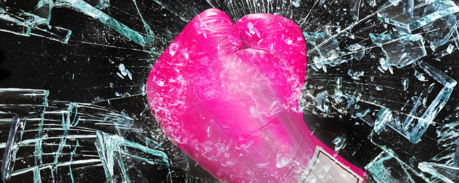 Breaking bias - image of pink boxing glove smashing glass
