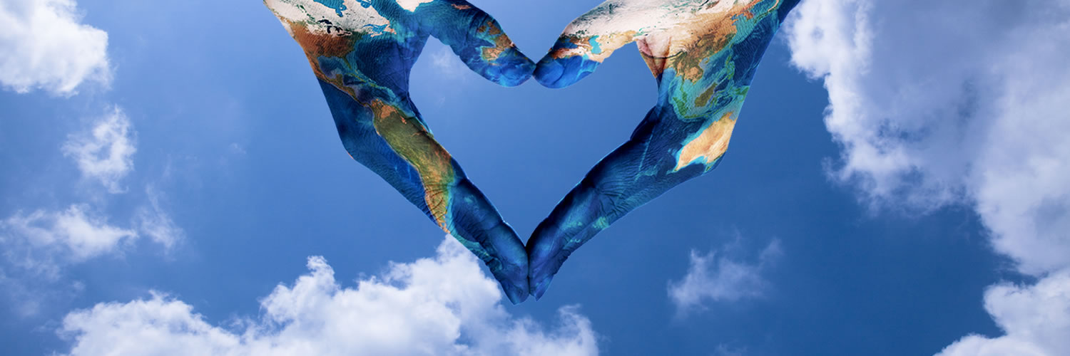 Building a diverse and inclusive business community - image of hands painted as globe in heart shape against clouds